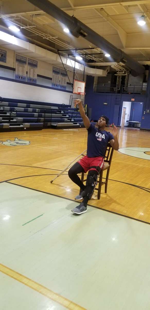 M.J. Rice shoots jump shots despite being in a cast.